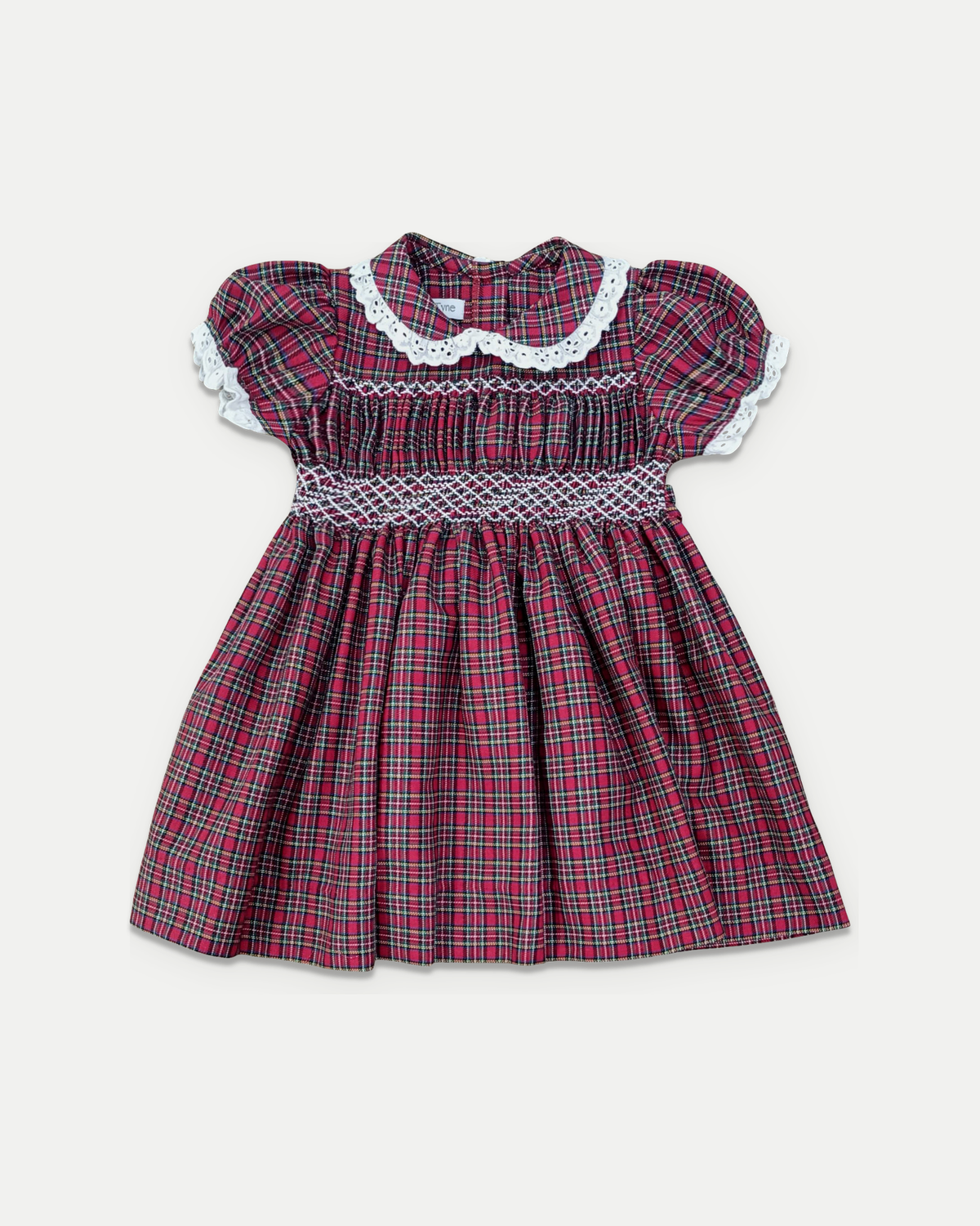 Polly Dress in holiday plaid with white smocking and Peter Pan collar